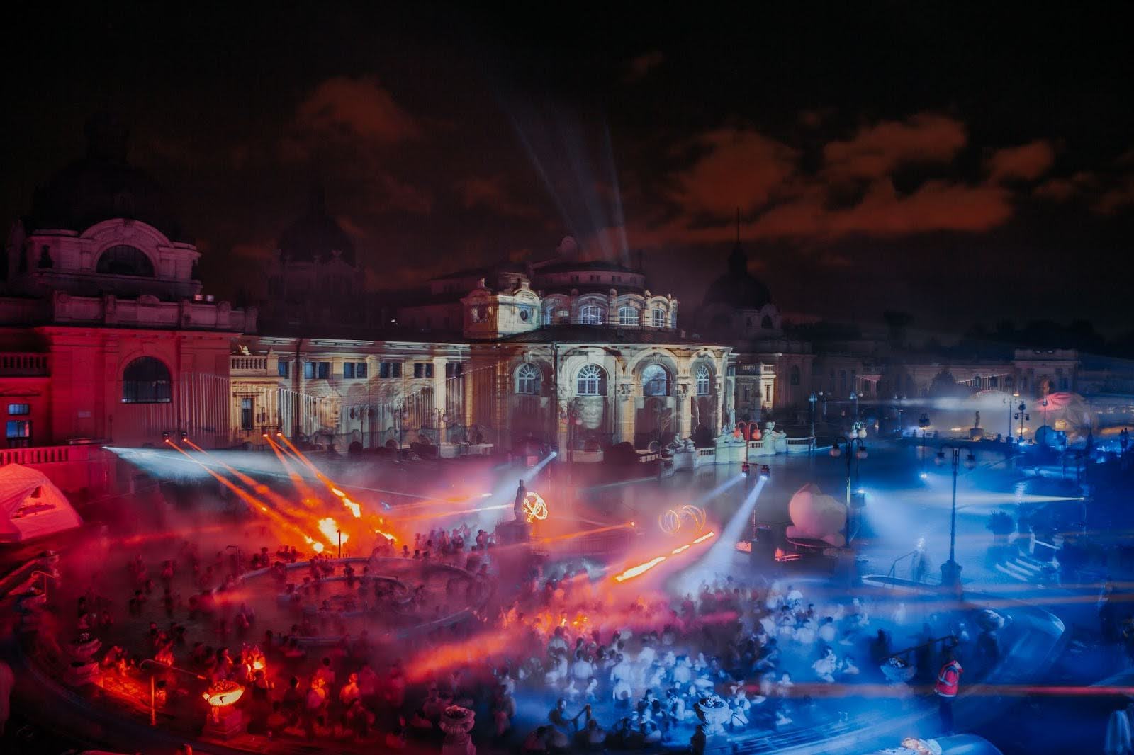 Sparty at the Szechenyi Bath at night, the outdoor pools lit red and blue
